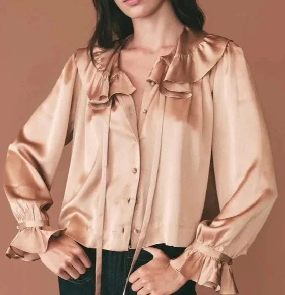 Women’s silk blouse in light brown with ruffled collar, button front, and gathered cuffs