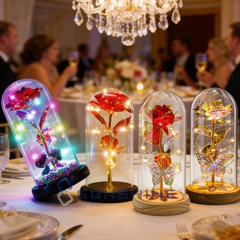 LED-lit red rose in clear glass dome with light accents on base