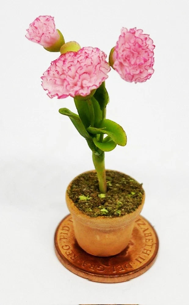 1:12 scale pink carnation bunch in a small ceramic pot with mossy soil