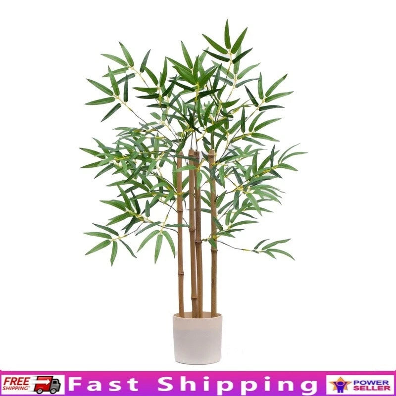 Artificial bamboo tree with green stalks in a light beige planter pot