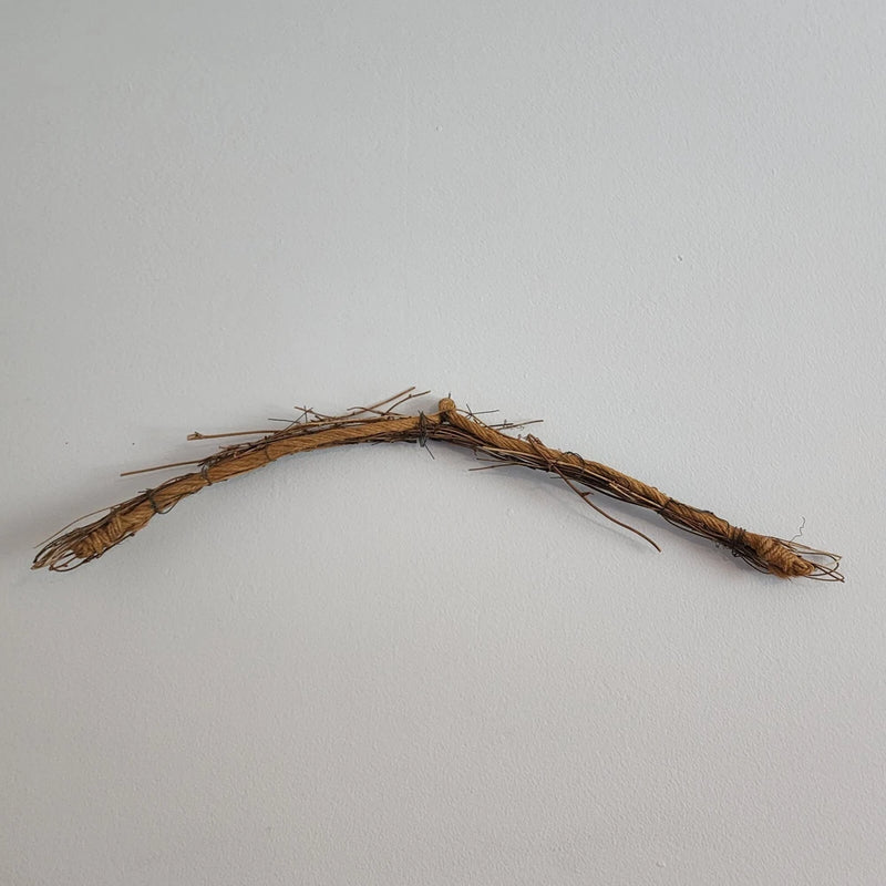 Arched grapevine wall swag wreath with dried stems