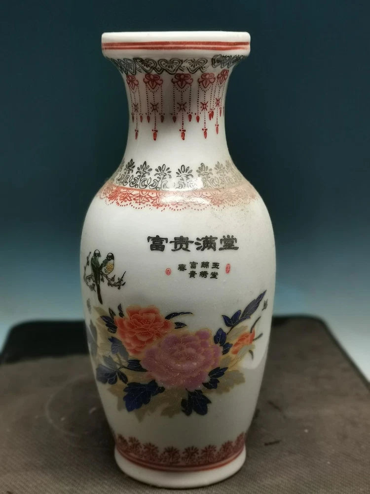 Porcelain vase with peony floral painting and Chinese calligraphy, red and blue trim