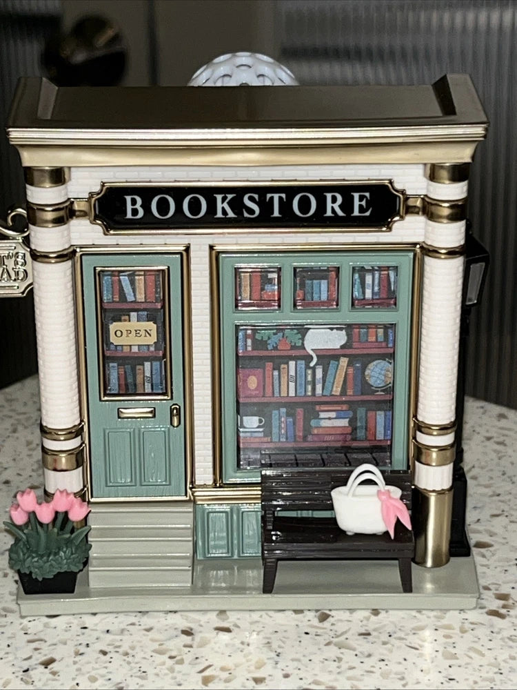 Decorative bookstore wallflower plug-in with 'BOOKSTORE' facade, door, and window details