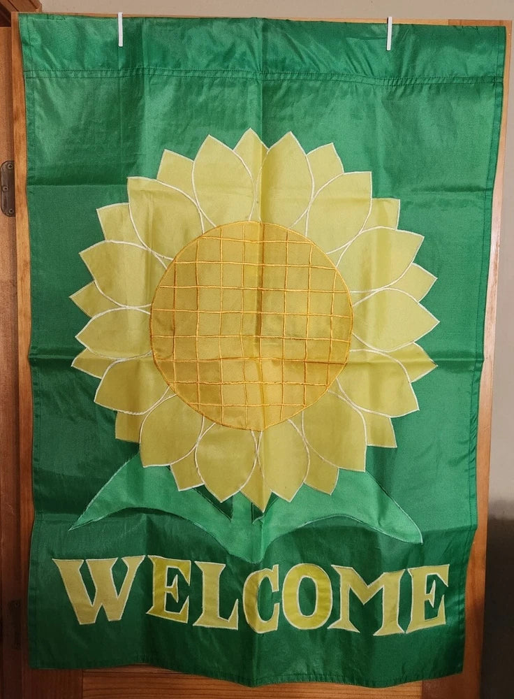 Green double-sided welcome banner flag with sunflower and 'WELCOME' text