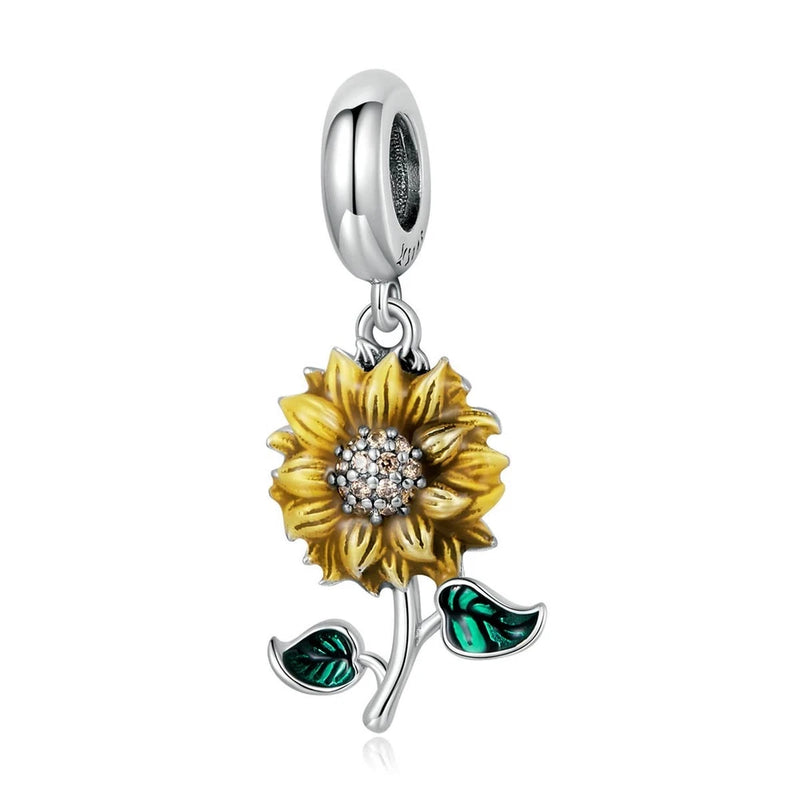 Sunflower charm bead: gold enamel flower, crystal center, silver leaves, hanging loop