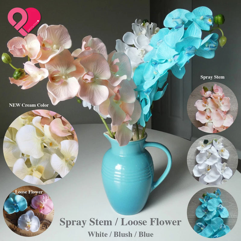 Artificial orchid spray stems with blush and aqua blooms in a turquoise vase