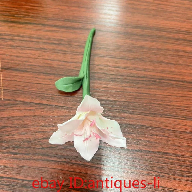 Porcelain lily flower ceramic ornament with green stem and white petals, pink center