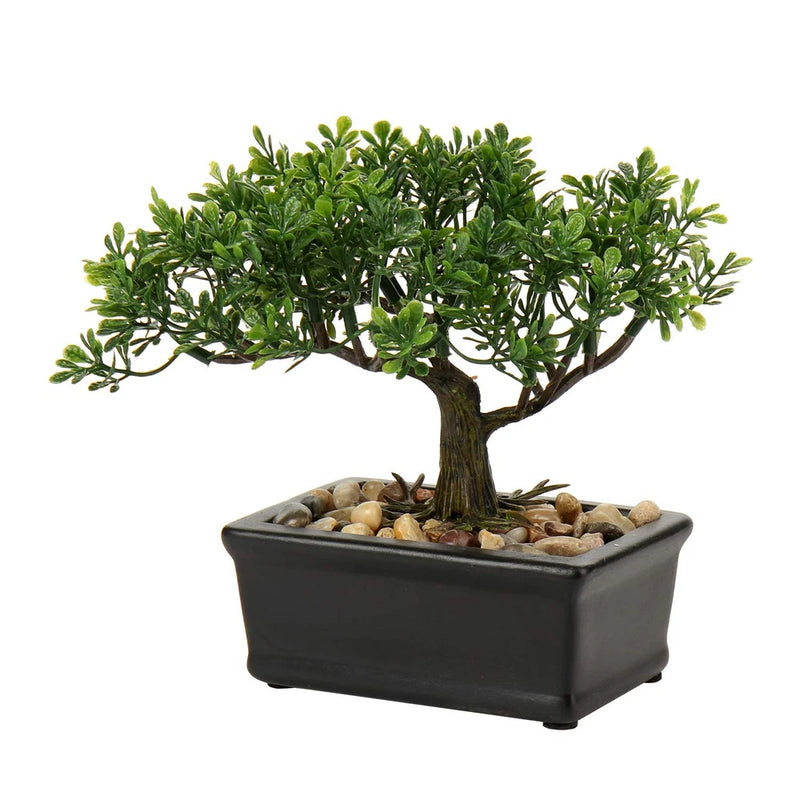 Artificial bonsai tree with green foliage in a dark square stone-filled pot