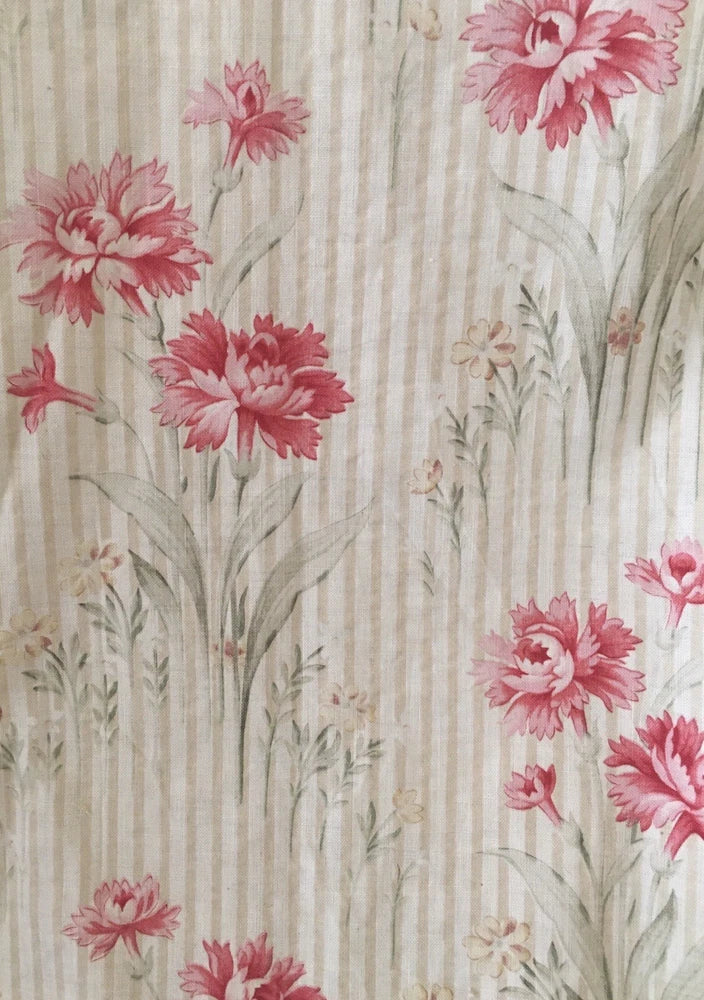 Cotton fabric with vertical cream stripes and pink carnation floral print