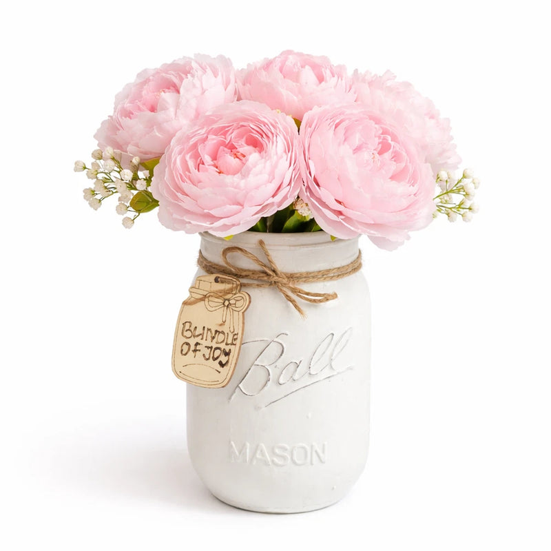 Mason jar centerpiece with pink peonies, twine bow, and Ball Mason label