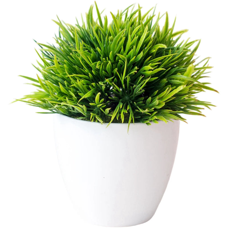 Artificial bonsai plant in white pot with dense bright green spiky foliage