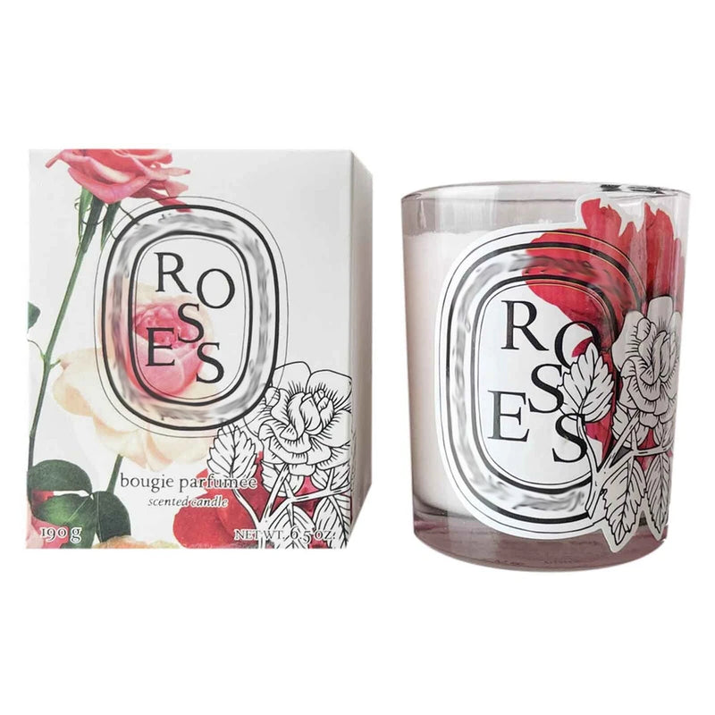 Diptyque rose scented candle in clear glass jar with floral rose design