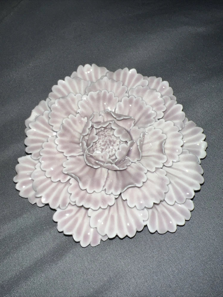 Handmade peony flower decor with layered ruffled petals in light pink and white