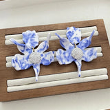 LeleSadoughi resin dyed blue and white porcelain resin lily flower earrings Lily