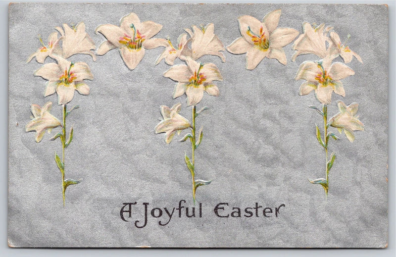 Vintage embossed Easter postcard with lily flowers and A Joyful Easter text
