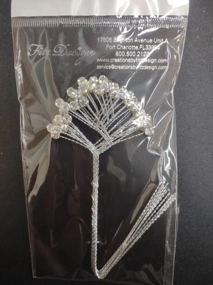 Clear rhinestone spray with tree centerpiece and dangling silver beaded strands
