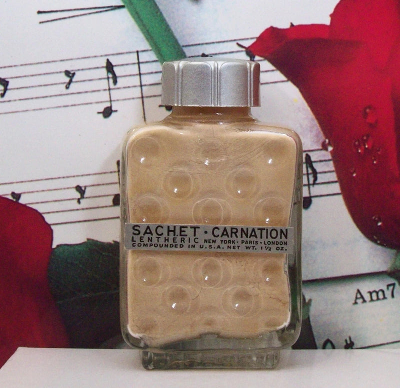 Lentheric carnation dry perfume sachet bottle with silver cap and beige liquid