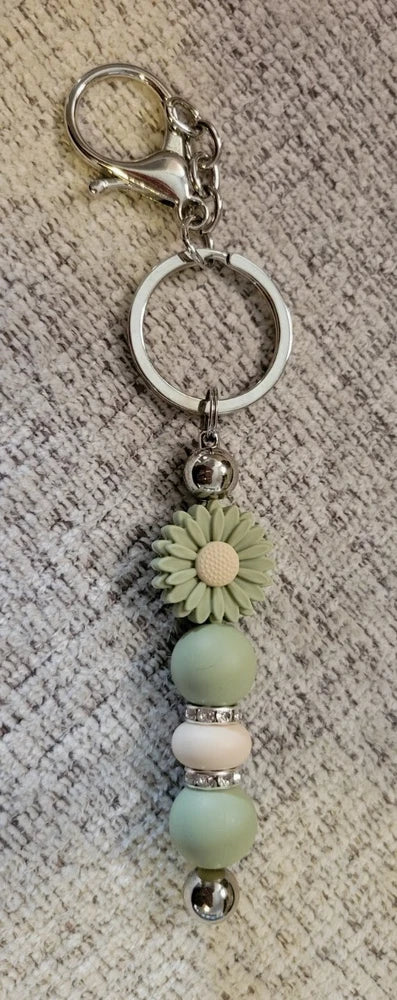 Sunflower keychain with metal keyring, sunflower charm, and light green bead dangles
