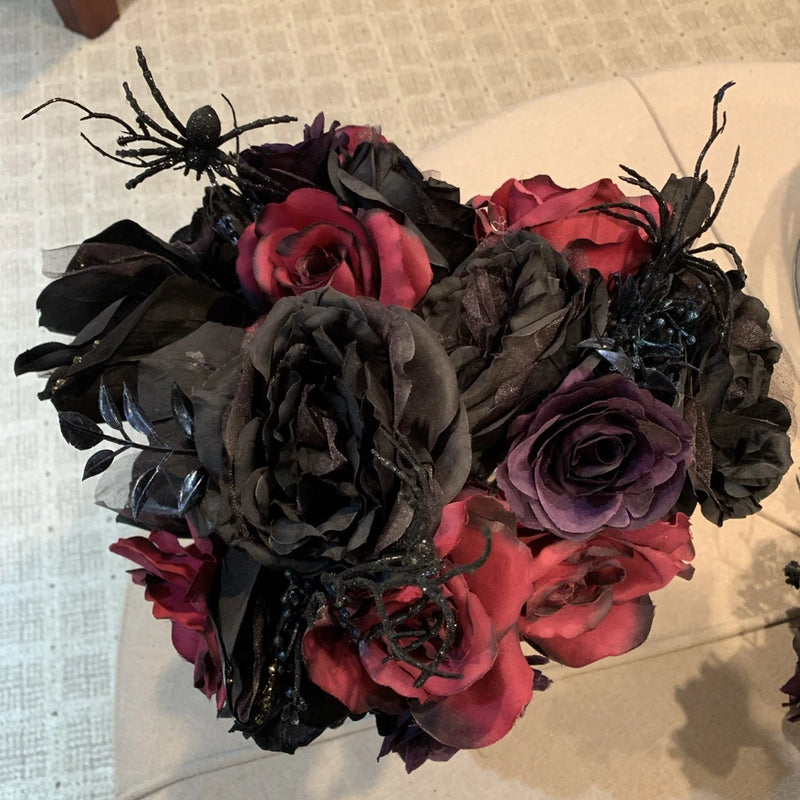 Halloween floral bouquet with dark roses and peony-style blooms in red and purple