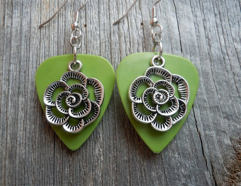 Green guitar-pick earrings with silver flower charm dangles