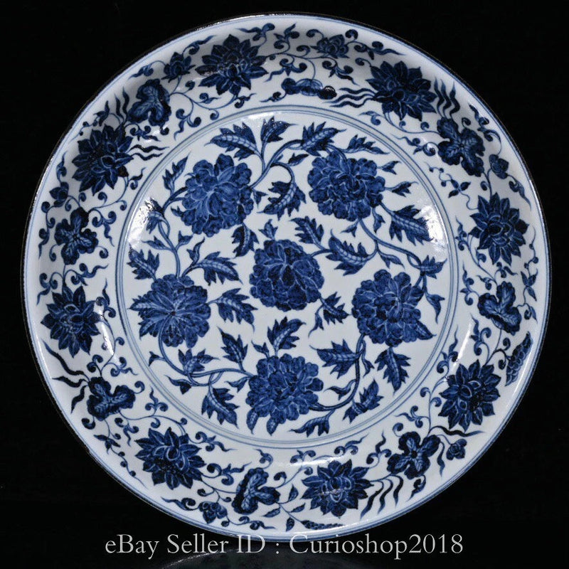 Round blue-and-white porcelain plate with ornate floral peony pattern