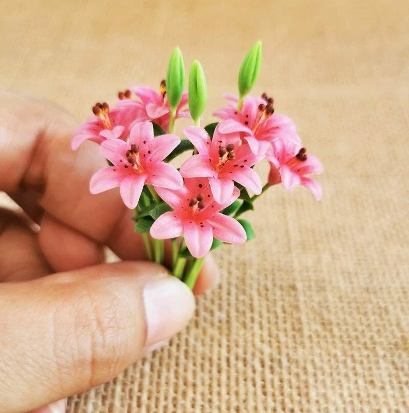 Miniature pink lily clay flower bouquet with green stems