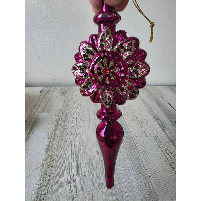 Purple glitter flower ornament with circular medallion center and teardrop top