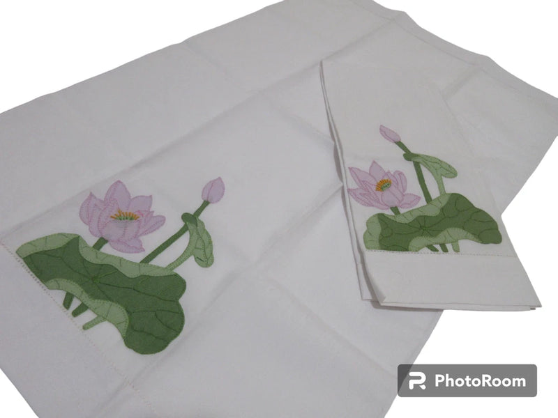 Set of 2 white napkins with embroidered lily pad flowers in green and pink