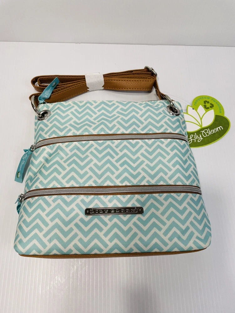Teal chevron crossbody bag with top zipper, front zip pocket, brown trim, silver hardware