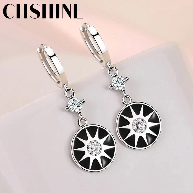 925 sterling silver hoop earrings, black sunburst discs with crystal center and charm drop