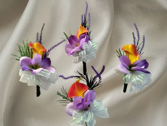 Formal boutonniere pin set with purple and yellow flowers, lavender stems, and ribbons