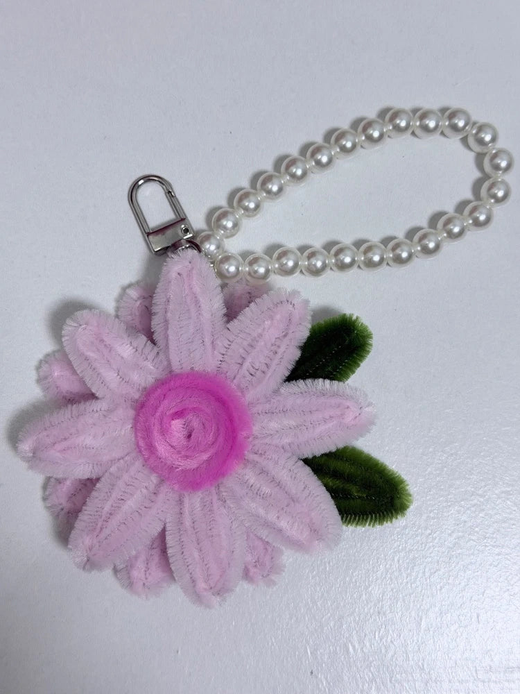 Light pink fabric sunflower keychain with pearl bead strap and metal key ring clip