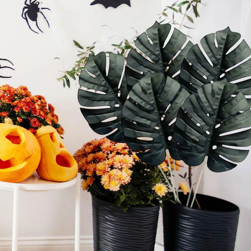 Artificial palm leaves set with dark green split leaf cutouts on thin stems