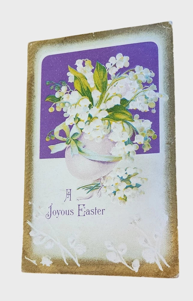 Joyous Easter postcard with lily of the valley flowers in a white vase and purple panel