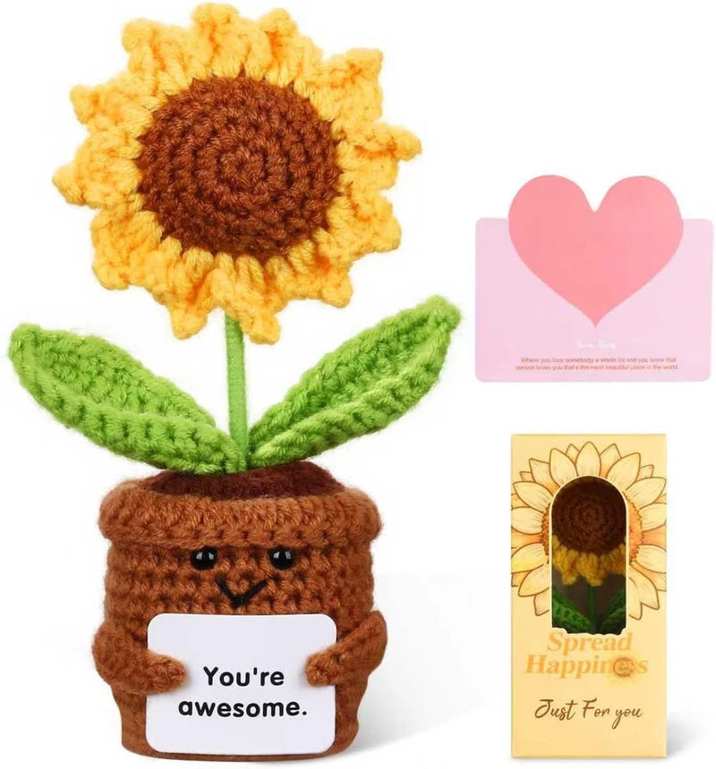 Crocheted sunflower with brown pot and face, with two greeting cards featuring hearts.