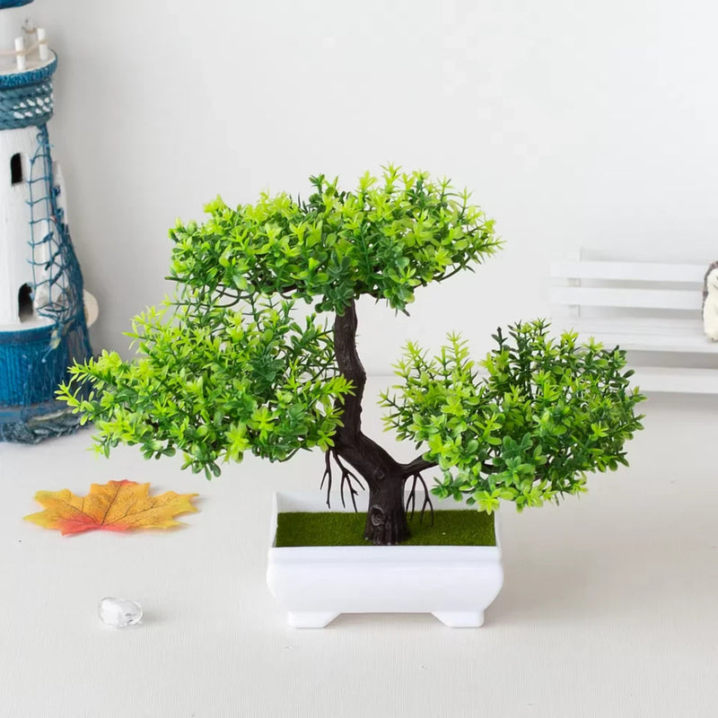 Artificial bonsai tree in white rectangular pot with bright green leafy branches