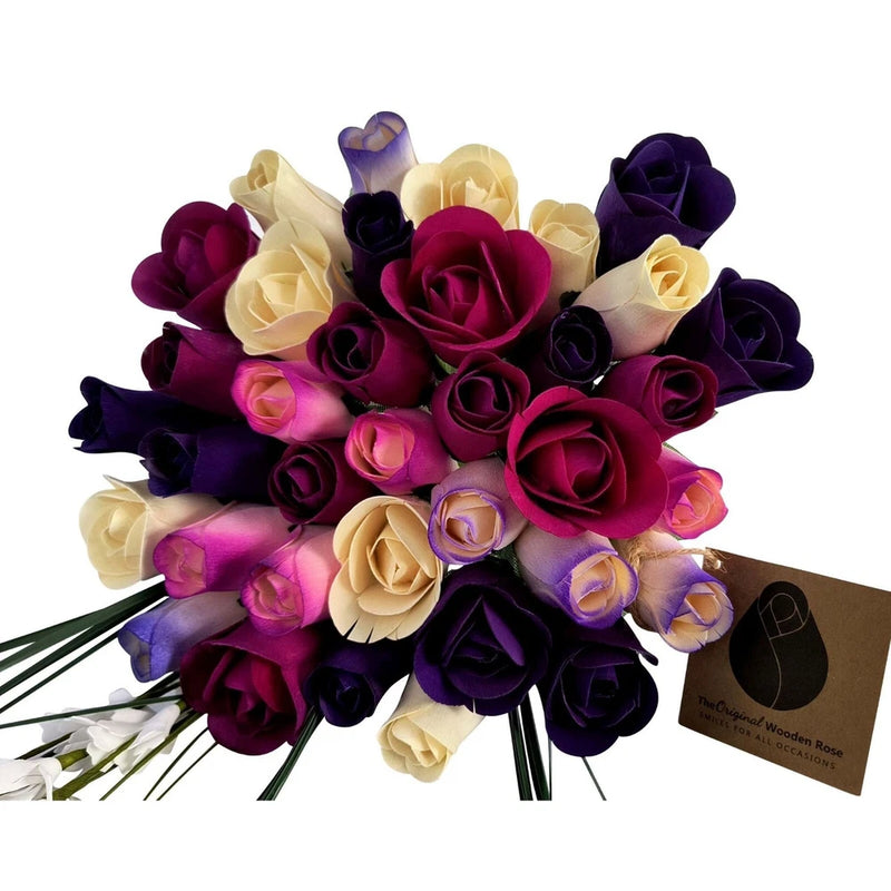 Purple and cream rose bouquet with dark maroon and ribbon accents