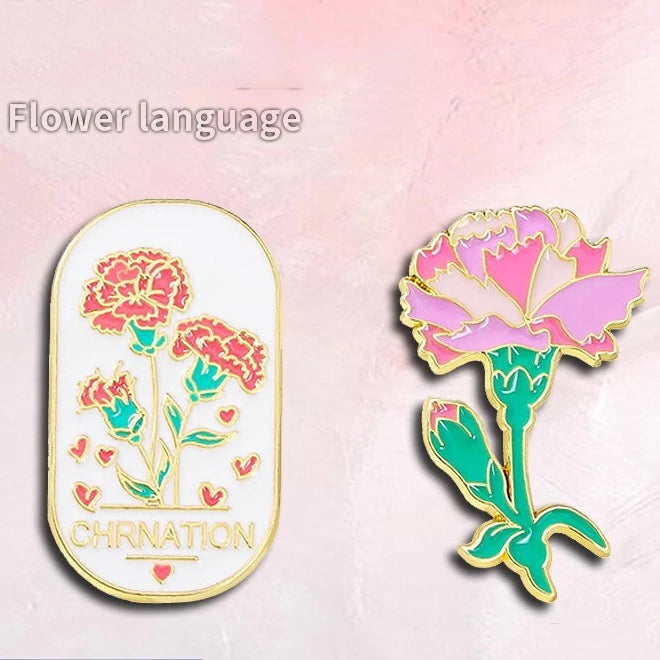 Enamel carnation flower brooches: oval white gold frame and purple-pink flower pin.