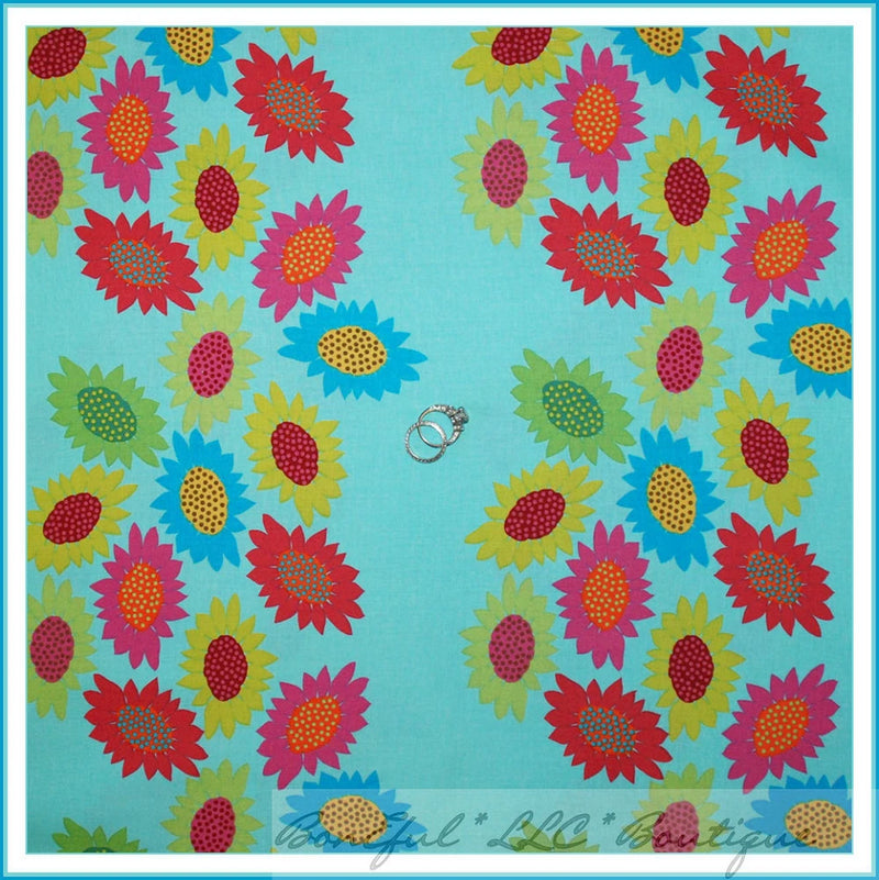 Cotton quilt fabric, turquoise blue with multicolor daisy-like flower print