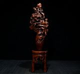 Carved peony flower and leaf branch wooden sculpture with pedestal, dark brown