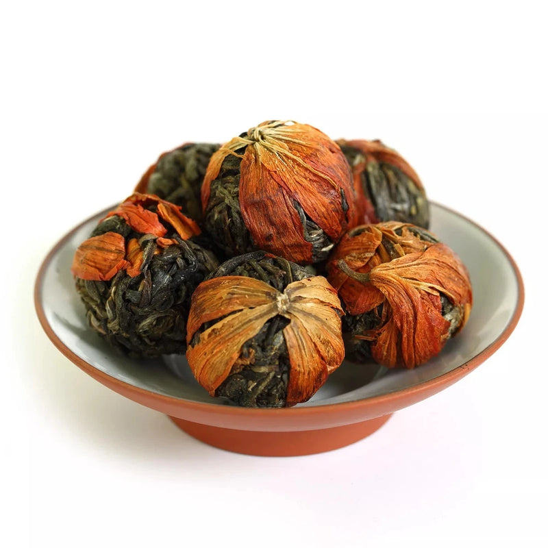 Puerh tea tuo cha with lily flowers—dark tea balls with orange dried blossoms