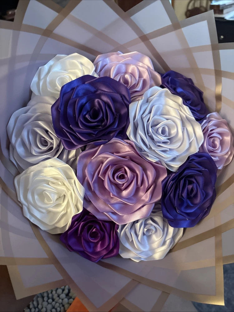 Handmade satin ribbon rose bouquet with white, lavender, and dark blue roses