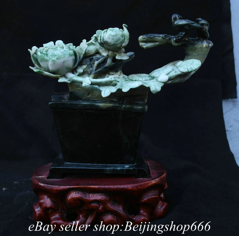 Carved pale green jade peony and bird figurine in black square pot pedestal