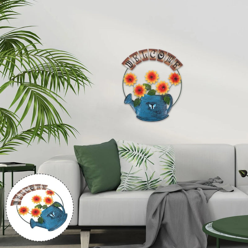 Circular metal door sign with sunflowers and blue watering can, welcome home text