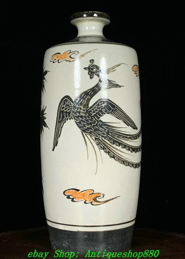 White porcelain bottle vase with painted phoenix bird and peony-flower accents, narrow neck