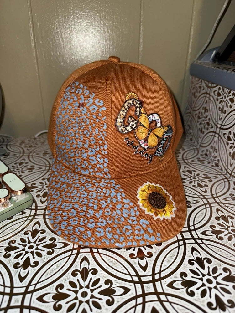 Orange baseball cap with sunflower and bee embroidery, curved brim