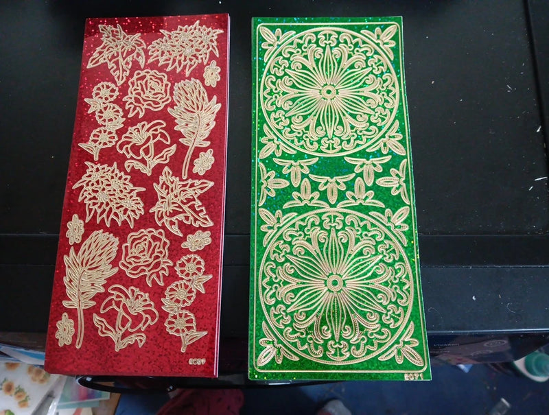 Holographic sticker sheets with red and green ornate floral rose designs