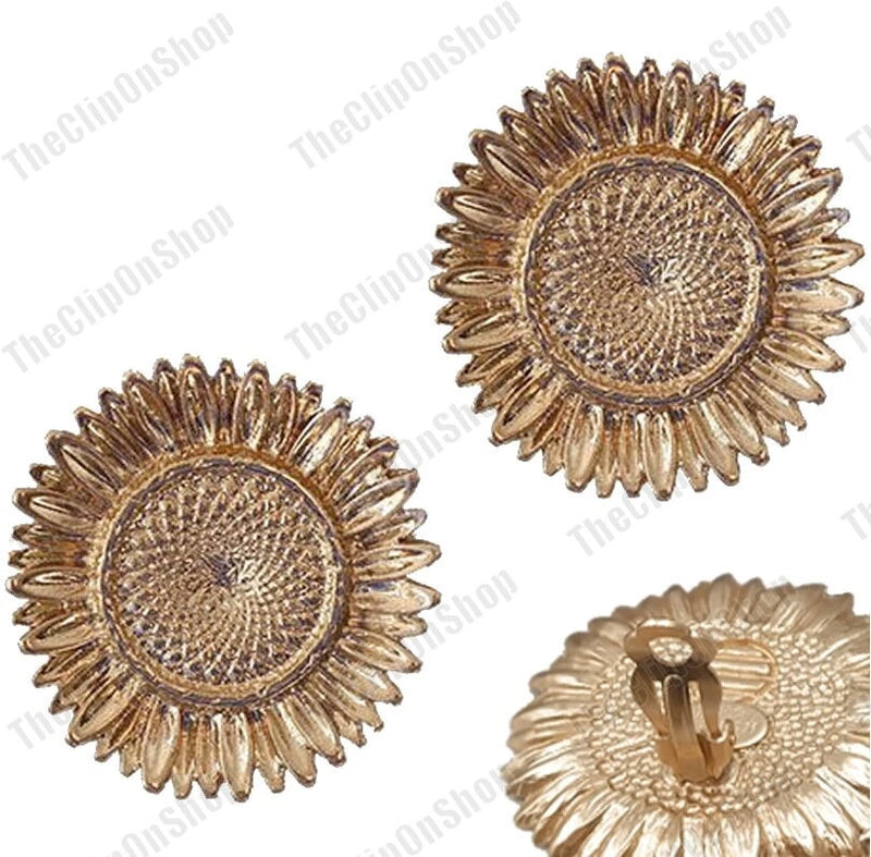 Matt gold sunflower clip-on earrings with textured metal petals; visible clip backs