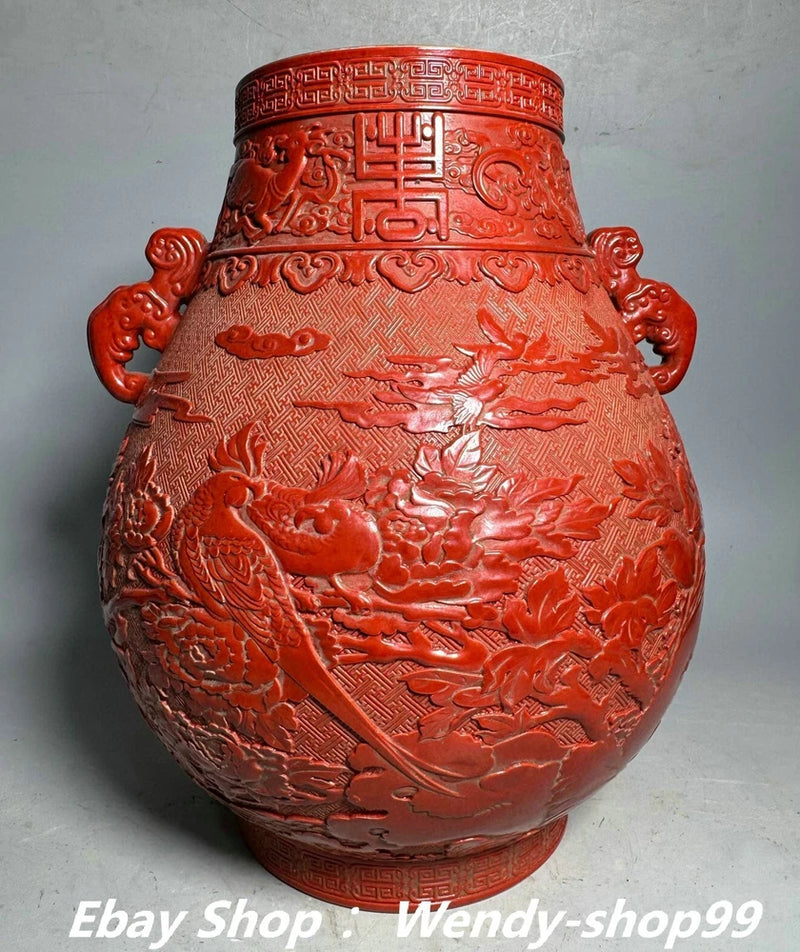 Red glazed porcelain vase with relief peony, birds, and magpie, gilt accents