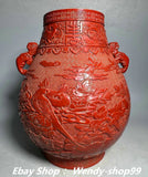 Red glazed porcelain vase with relief peony, birds, and magpie, gilt accents